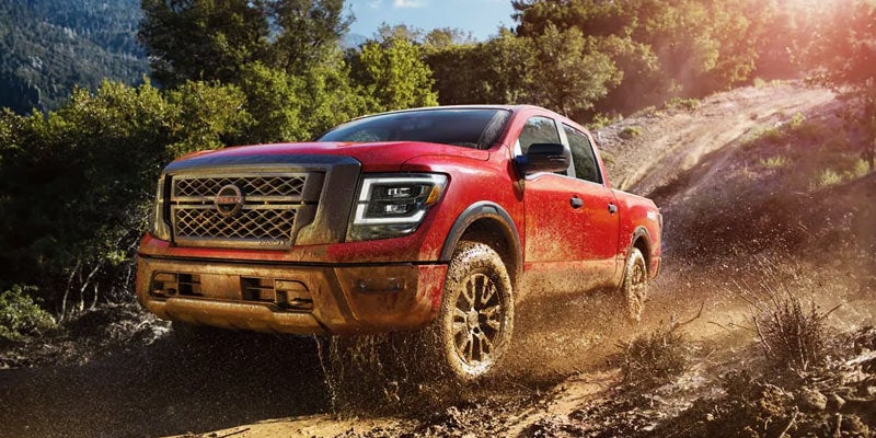 A 2024 Nissan Titan getting messy for its powerful off-roading near Pompano Beach, FL