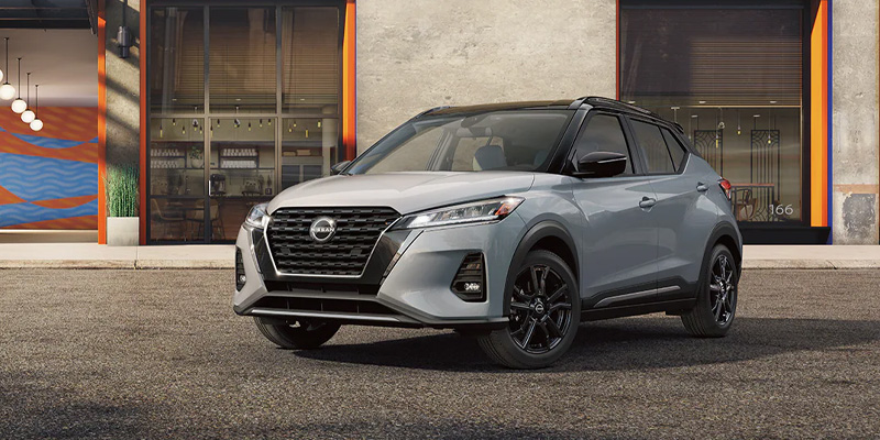 A 2024 Nissan Kicks parked outside of a posh area in Pompano Beach, FL 