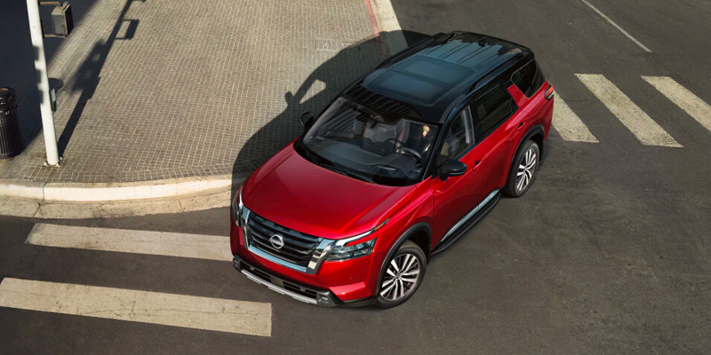 A 2025 Nissan Pathfinder taking a turn in Pompano Beach, FL 