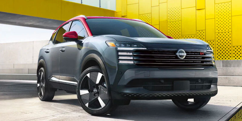 A 2025 Nissan Kicks parked outside of a contemporary building in Pompano Beach, FL