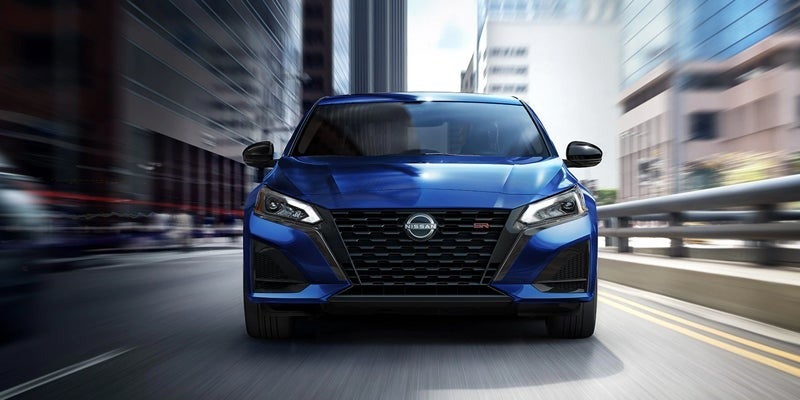 A 2024 Nissan Altima that is blurred for its speed in Pompano Beach, FL