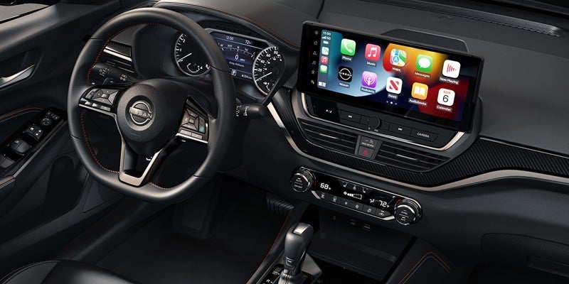 The center console and infotainment system in the 2024 Nissan Altima in Pompano Beach, FL