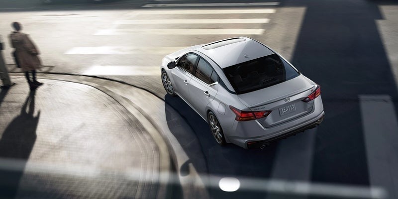 A 2024 Nissan Altima taking a sharp turn in Pompano Beach, FL